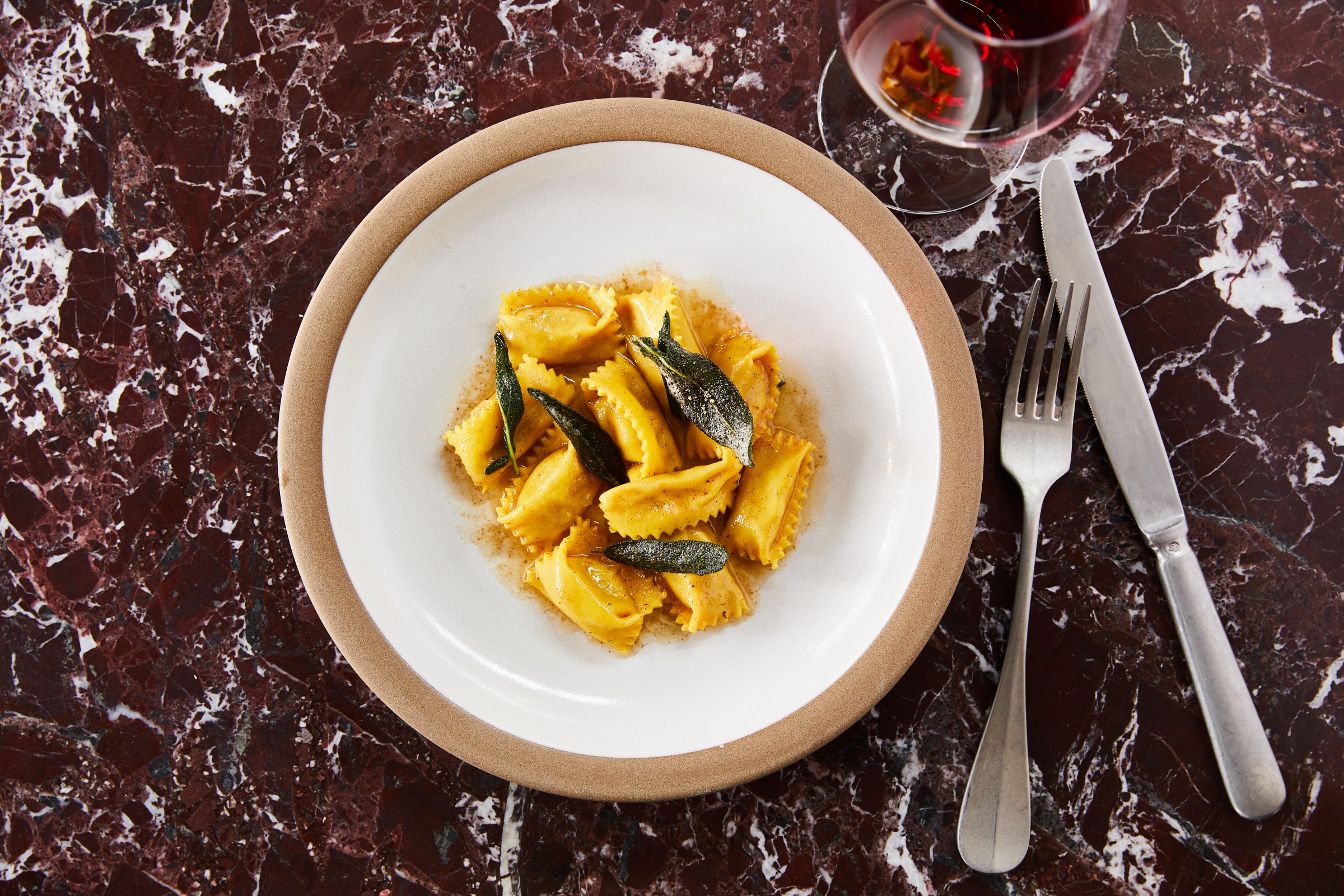 Agnolotti pasta served in a white and brown trim platter at San Morello inside the Shinola Hotel, downtown Detroit, Michigan.